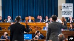 Top U.S. diplomat in Ukraine William Taylor, left, and Career Foreign Service officer George Kent are sworn in prior to testifying before the House Intelligence Committee on Capitol Hill in Washington, Nov. 13, 2019.