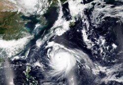 This Friday, Sept. 4, 2020, satellite image released by NASA Worldview, Earth Observing System Data and Information System (EOSDIS) shows Typhoon Haishen, or Sea God in Chinese, approaching Japan's southern regions this weekend.
