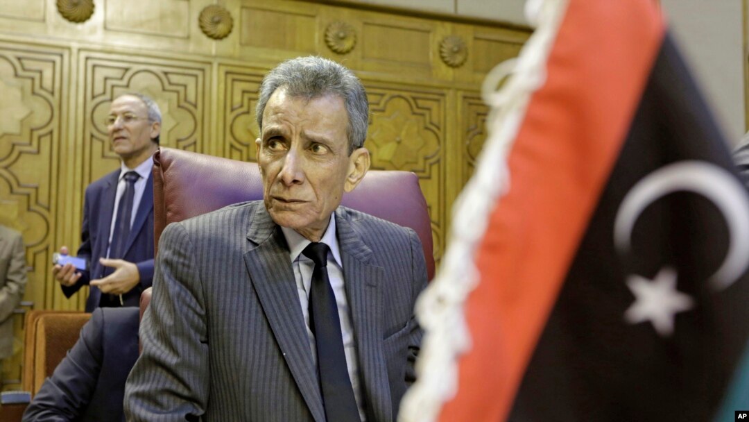 FILE - Libyan representative Ashour Abu-Rashed attends an emergency meeting to discuss the conflict in Libya, at the Arab League headquarters in Cairo, Jan. 5, 2015. 
