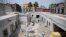 Masons work on restoring the building at 25 Manzanares Street, the oldest house in Mexico City, Sept. 10, 2018.