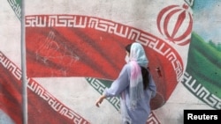 FILE - An Iranian woman walks in a street in Tehran, Iran, April 9, 2023. Majid Asgaripour/WANA (West Asia News Agency) via REUTERS