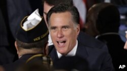 Republican presidential candidate, former Massachusetts Gov. Mitt Romney greets veterans as he campaigns at American Legion Post 176 in Springfield, Virginia, September 27, 2012. 