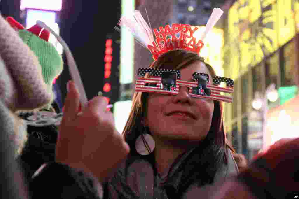 Bernadette Brandl smiles as she takes part in the New Year's Eve festivities in New York's Times Square Saturday Dec. 31, 2011. Brandl, who is originally from Austria, is currently living in Minnesota. (AP)