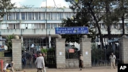 FILE - Pedestrians walk past the Federal High Court building in Addis Ababa, Ethiopia, Nov. 1, 2011. A new law adopted Jan. 2, 2019, replaces controversial language that has been used to arrest scores of journalists and politicians over the years.