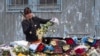 A flower shop employee cuts up unsold flowers in St. Petersburg, Russia.