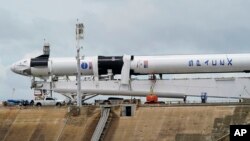 The SpaceX Falcon 9, with Dragon crew capsule is serviced on Launch Pad 39-A, Tuesday, May 26, 2020, at the Kennedy Space Center in Cape Canaveral, Fla. Two astronauts will fly on the SpaceX Demo-2 mission to the International Space Station.