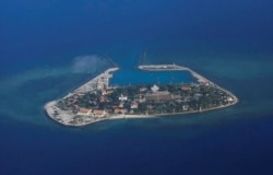 FILE - An aerial view of Southwest Cay, also known as Pugad Island, controlled by Vietnam and part of the Spratly Islands in the disputed South China Sea, April 21, 2017.