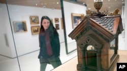 This Wednesday, Jan. 9, 2019, photo shows a British Edwardian-style Dog House for a Chihuahua on display at the American Kennel Club Museum of the Dog in New York. The museum opens Feb. 8. (AP Photo/Mary Altaffer)