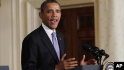 U.S. President Barack Obama and South Korean President Lee Myung-bak (not in photo) hold a joint news conference in the East Room of the White House, October 13, 2011.