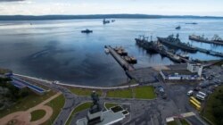 FILE - An aerial view shows Russian navy ships at the port of Severomorsk, Russia, July 30, 2016.