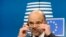 FILE - European Commissioner for economics, taxation and customs Pierre Moscovici attends a press conference after an eurozone finance ministers meeting in Brussels, Dec. 8, 2014. 
