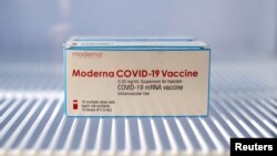 A box of the Moderna coronavirus disease (COVID-19) vaccine is seen in a fridge at a vaccination center in Le Cannet, France, January 19, 2021. REUTERS/Eric Gaillard