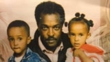 FILE - Dawit Isaak, an Eritrean-Swedish journalist and advocate for human rights, center, poses with his children, who include his daughter, Betlehem Isaak, right, who continues to fight for the release of her father, who has been imprisoned without trial in Eritrea since 2001.