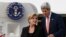 U.S. Secretary of State John Kerry (R) steps off his aircraft alongside Australia's Foreign Minister Julie Bishop in Sydney, August 11, 2014.