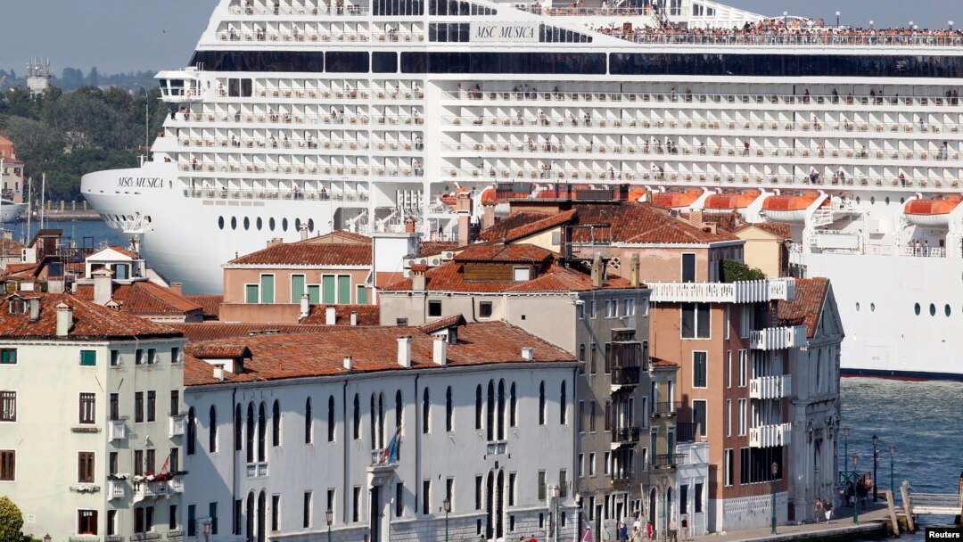 FILE - The MSC Musica cruise ship is seen in Venice lagoon June 17, 2012. Since the wreck of the Costa Concordia, environmentalists have stepped their efforts to have large cruise ships banned from the lagoon which surrounds the historic center of the canal city.