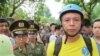 FILE - Anti-China protester surrounded by police in Hanoi, Vietnam, May 18, 2014 (Marianne Brown/VOA)