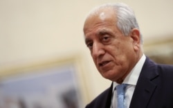 FILE - U.S. Special Representative for Afghanistan Reconciliation Zalmay Khalilzad attends the Intra-Afghan Dialogue talks in Doha, July 8, 2019.