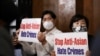 Members of the Atlanta Korean American Committee against Asian Hate Crime show placards as they meet at Ching Dam, a Korean restaurant, after the fatal shooting at three Georgia spas, in Duluth, Georgia, March 18, 2021.