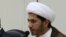 FILE - Sheikh Ali Salman, now on trial for allegedly advocating an overthrow of the Bahrain regime, speaks at a news conference in Umm Al Hassam, Bahrain, Feb. 15, 2012.