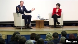 Alex Younger, Chief of Britain's Secret Intelligence Service, known as MI6, sits next to St. Andrews University Principle Professor Sally Mapstone during an event at the University of St. Andrews, Scotland, Britain Dec. 3, 2018. 