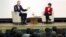 Alex Younger, Chief of Britain's Secret Intelligence Service, known as MI6, sits next to St. Andrews University Principle Professor Sally Mapstone during an event at the University of St. Andrews, Scotland, Britain Dec. 3, 2018. 