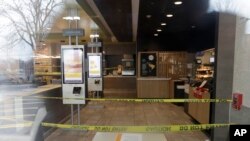 FILE - A closed off seating area is seen inside a McDonald's restaurant in Arlington Heights, Illilois, March 18, 2020. 