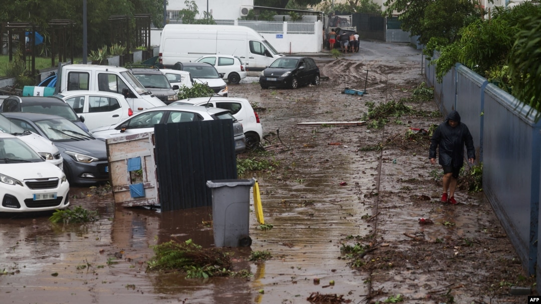 A man walks on a damaged street following Tropical Cyclone Garance in Saint-Denis, on the French overseas Indian Ocean island of Reunion, Feb. 28, 2025. 