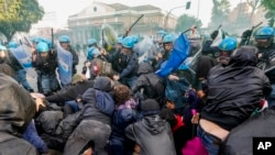 Italian police and demonstrators clash during a march in support of the Palestinian people in Rome, Oct. 5, 2024.