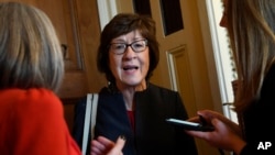FILE - Sen. Susan Collins, R-Maine, talks to reporters on Capitol Hill in Washington.