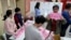 资料照片：2024年1月13日台湾总统大选日，新北市投票站工作人员正在计票。
