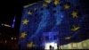 FILE - The European flag is projected on the government building as the TV tower is illuminated in blue in the background in Tbilisi, Georgia, December 18, 2015.