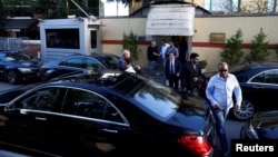 Officials leave Saudi Arabia's consulate in Istanbul, Turkey, Oct. 7, 2018.