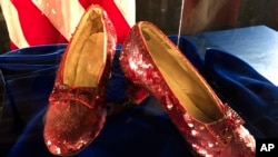 FILE - Ruby slippers once worn by Judy Garland in the "The Wizard of Oz," are displayed at a news conference, Sept. 4, 2018, at the FBI office in Brooklyn Center, Minn.