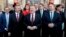 Danish Prime Minister Lars Loekke Rasmussen, center, presents his new government with 22 ministers in front of the Amalienborg Palace in Copenhagen, Nov. 28, 2016. At his left is Foreign Minister Anders Samuelsen.