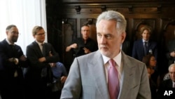 FILE - Ukrainian tycoon Dmytro Firtash waits for the start of a hearing on his extradition to the U.S., at Austria's Supreme Court, in Vienna, Austria, June 25, 2019. 