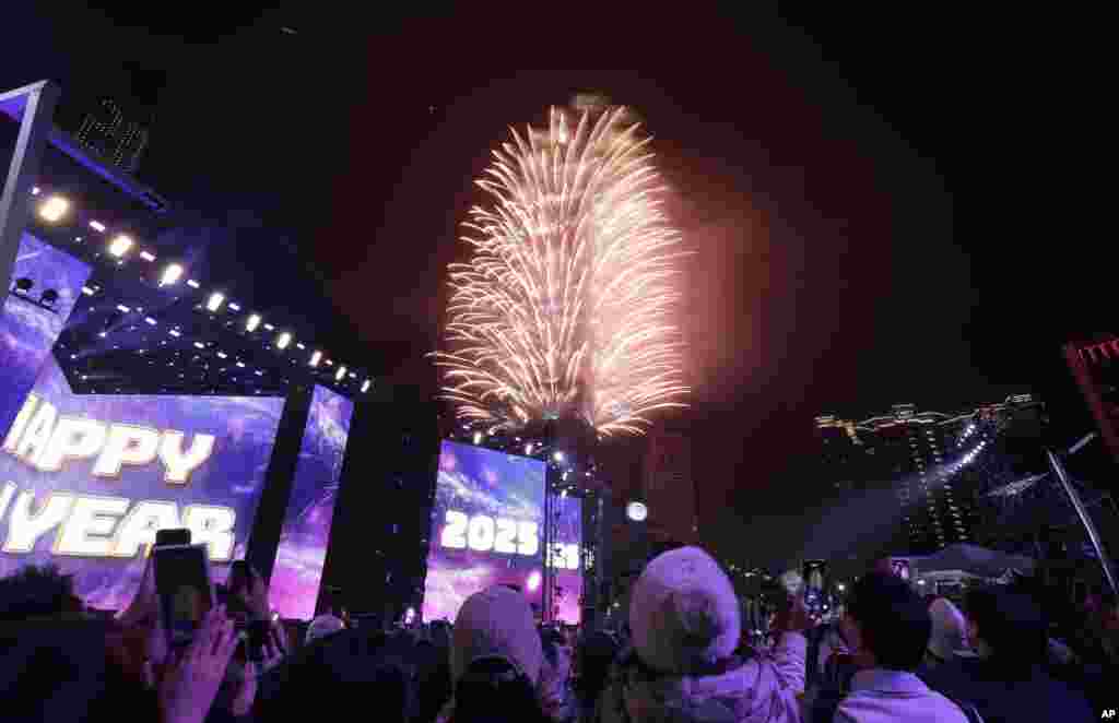 Fireworks explode from the Taipei 101 building during the New Year's celebrations in Taipei, Taiwan, Jan. 1, 2025.