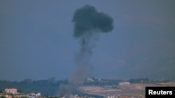 Smoke billows on Lebanon’s side of the border with Israel, amid hostilities between Hezbollah and Israeli forces, as seen from Mount Addir, northern Israel, Nov. 4, 2024.