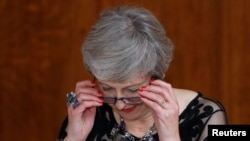 Britain's Prime Minister Theresa May delivers a speech during the annual Lord Mayor's Banquet at Guildhall in London, Britain, November 12, 2018.