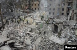 Rescuers work at a site of a residential building destroyed by a Russian missile strike, amid Russia’s attack on Ukraine, in Kramatorsk, Ukraine Feb. 2, 2023.