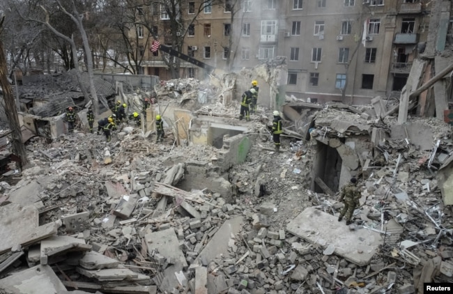 Rescuers work at a site of a residential building destroyed by a Russian missile strike, amid Russia’s attack on Ukraine, in Kramatorsk, Ukraine Feb. 2, 2023.