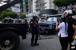 Police take possession of the truck from which opposition leader Maria Corina Machado addressed supporters at a protest in Caracas, Venezuela, Jan. 9, 2025, the day before President Nicolas Maduro's inauguration for a third term.