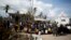 United Nations police from Bangladesh deliver drinking water to residents of Sous-Roche village, outside Les Cayes, Haiti, Oct. 11, 2016. 