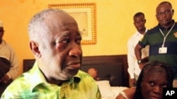 April 11: Former Ivorian President Laurent Gbagbo and his wife Simone, in the custody of forces loyal to Alassane Ouattara at the Golf Hotel in Abidjan, Ivory Coast. Forces stormed the bunker and arrested Gbagbo, whose refusal to hand over the presidency