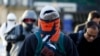 Commuters brave cold weather while walking the streets of Chicago, Illinois, Jan. 28, 2014.