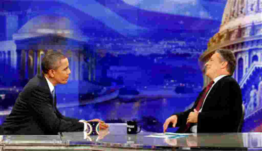 President Barack Obama is pictured during a commercial break as he talks with host Jon Stewart as he takes part in a taping of Comedy Central's The Daily Show with Jon Stewart, Wednesday, Oct. 27, 2010, in Washington. (AP Photo/Charles Dharapak)