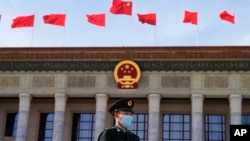 File - A Chinese soldier stands guard outside the Great Hall of the People after the opening ceremony of The Third Belt and Road Forum in Beijing, Oct. 18, 2023.