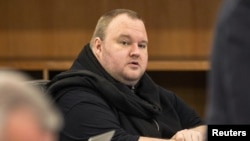 German tech entrepreneur Kim Dotcom sits in a chair during a court hearing in Auckland, New Zealand, Sept. 24, 2015. 