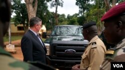 The U.S. Ambassador to Central African Republic Jeffrey Hawkins and the Central African Republic's deputy chief of staff for planning, Lieutenant Colonel Ishmael Koagu, check out a trucks being provided by the U.S. government to the C.A.R. army. (Z. Bad