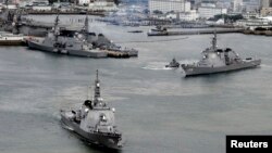 Japan Maritime Self-Defense Force's (JMSDF) Aegis destroyers Myoko (L) and Kongo sail off from the JMSDF Sasebo base in Sasebo, southern Japan, in this photo taken by Kyodo, Dec. 6, 2012. 