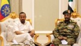 FILE: Ethiopian Prime Minister Abiy Ahmed meets Sudan's Head Of Transitional Military Council, Lieutenant General Abdel Fattah Al-Burhan Abdelrahman at the airport in Khartoum, Sudan 6.7.2019